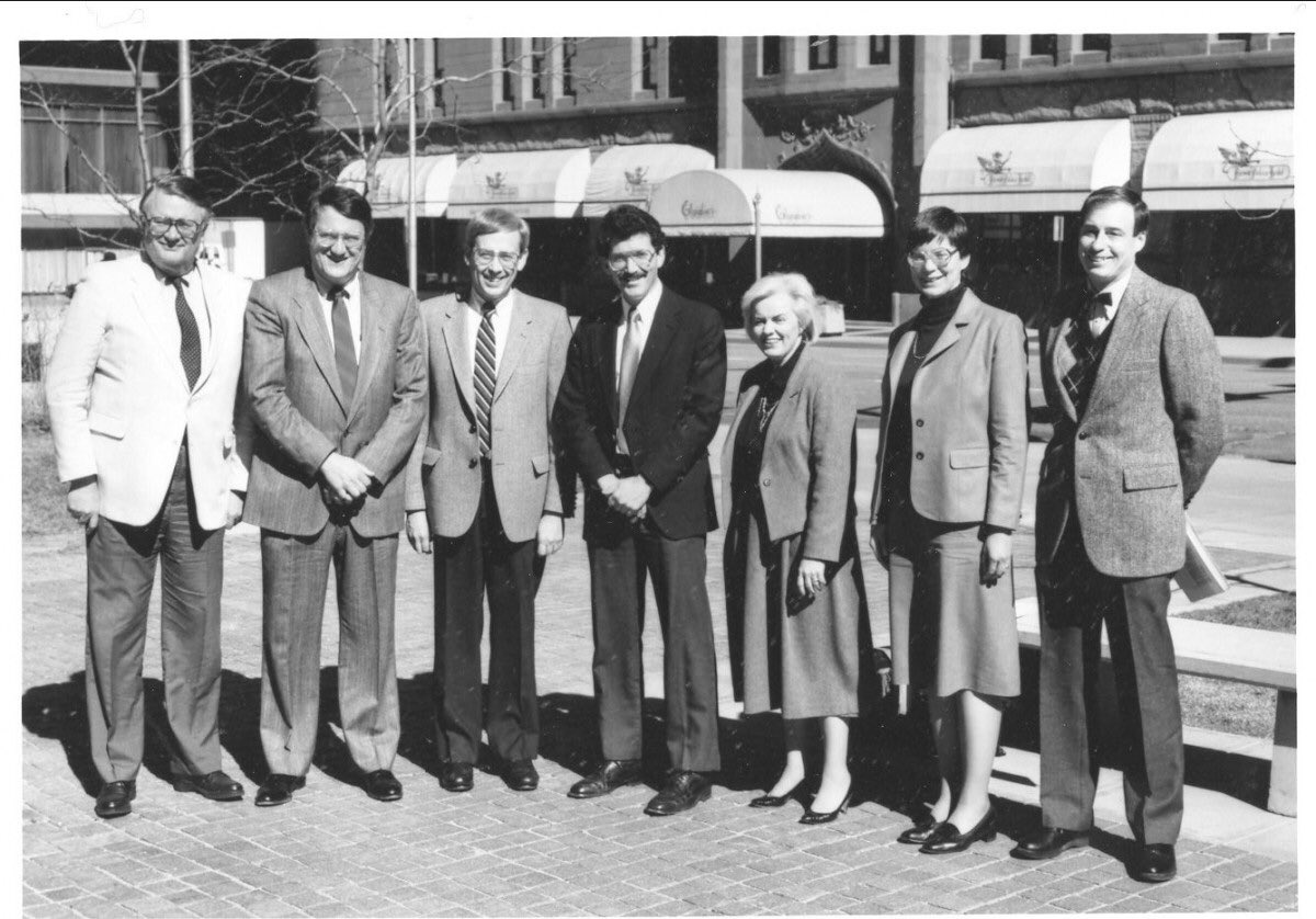 Exterior photo of men and women in business attire